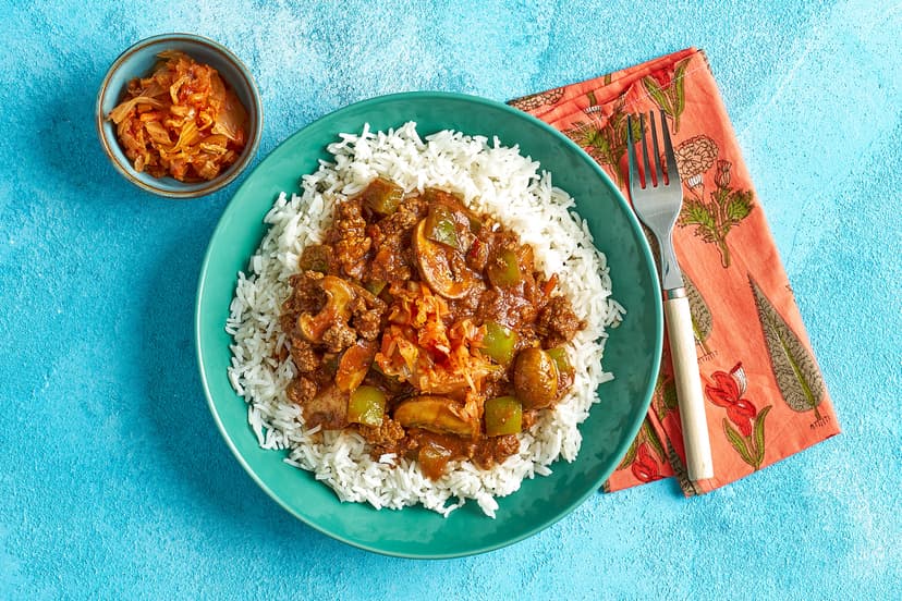 Dinner in 20? Yes, please! Minced beef is sizzled with mushrooms and green pepper in a tomato sauce flavoured with gochujang, garlic, ginger and soy. Topped with kimchi pickles and served with generous heaps of rice, it’s fast, filling and super-tasty.